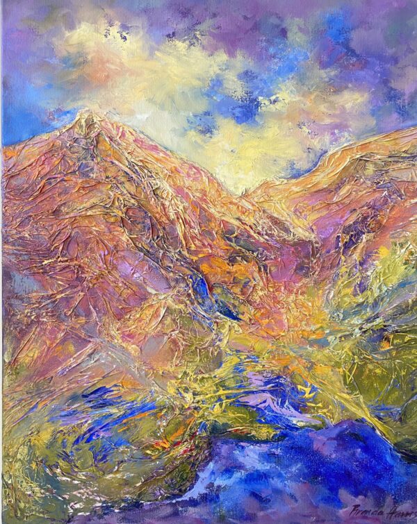 Mountain landscape with rugged peaks in shades of purple, beige, and blue under a partly cloudy sky.
